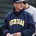 Michigan head coach Rich Maloney walks back to the dug out between innings at Eastern on Wednesday.  Melanie Maxwell I AnnArbor.com